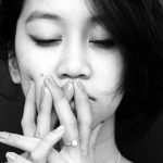 Woman closed eyes black white