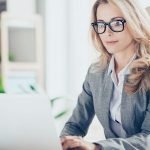 Woman with glasses at pc